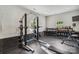 Functional weight room featuring squat rack, dumbbells, and bench, ideal for strength training and fitness enthusiasts at 4004 Henshaw Rd # 448, Waxhaw, NC 28173