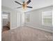 Spacious bedroom provides plush carpeting, natural light and an attached bathroom at 423 Pleasant Ave, Kannapolis, NC 28081