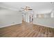 Open-concept area with new flooring, neutral colors, and a ceiling fan at 423 Pleasant Ave, Kannapolis, NC 28081