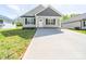 Charming single-story home with a concrete driveway and a covered front porch at 423 Pleasant Ave, Kannapolis, NC 28081
