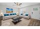 Bright living room featuring modern furnishings, neutral color scheme, and ceiling fan at 423 Pleasant Ave, Kannapolis, NC 28081