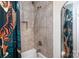 Shower showcasing contemporary tilework and fixtures, paired with a decorative shower curtain for a unique aesthetic at 4244 Donnybrook Pl, Charlotte, NC 28205