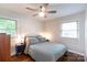 Cozy bedroom with wood floors, a ceiling fan, and lots of natural light at 4244 Donnybrook Pl, Charlotte, NC 28205