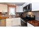Well-equipped kitchen featuring stainless steel appliances, modern cabinetry, and a stylish backsplash at 4244 Donnybrook Pl, Charlotte, NC 28205