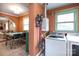 Bright laundry area featuring a washer, dryer, and a window for natural light at 4244 Donnybrook Pl, Charlotte, NC 28205