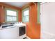 Functional laundry area with new appliances and neutral color palette at 4244 Donnybrook Pl, Charlotte, NC 28205