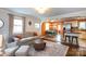Inviting living room featuring stylish furnishings and an open layout into the dining area and kitchen at 4244 Donnybrook Pl, Charlotte, NC 28205