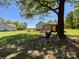 The large backyard features an expansive lawn with mature trees providing ample shade and privacy at 4285 Palmer Lloyd Rd, Lancaster, SC 29720