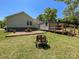 Green backyard with a brick firepit, picnic table, and shed in a fenced yard at 4285 Palmer Lloyd Rd, Lancaster, SC 29720
