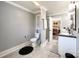 Well-lit bathroom featuring tile flooring, a toilet, a standing shower, and double sinks at 4285 Palmer Lloyd Rd, Lancaster, SC 29720