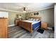 Spacious bedroom with hardwood floors, wooden furniture, and a ceiling fan at 4285 Palmer Lloyd Rd, Lancaster, SC 29720
