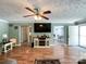 Comfortable living room with hardwood floors, a ceiling fan, and a view into the dining area at 4285 Palmer Lloyd Rd, Lancaster, SC 29720