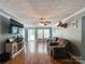 Cozy living room with hardwood floors, a ceiling fan, a view of the front yard, and comfortable seating at 4285 Palmer Lloyd Rd, Lancaster, SC 29720