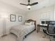 Comfortable bedroom with ceiling fan, desk, and serene lighting at 4303 Patriots Hill Rd, Mint Hill, NC 28227