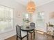 Bright dining area features wood floors, natural light, and stylish light fixture at 4303 Patriots Hill Rd, Mint Hill, NC 28227