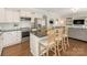 Well-equipped kitchen with an island, stainless steel appliances, and seamless flow to the living space at 4303 Patriots Hill Rd, Mint Hill, NC 28227