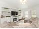 Stylish living room featuring built-in shelving, a fireplace, and a comfortable sectional sofa at 4303 Patriots Hill Rd, Mint Hill, NC 28227