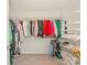 Spacious walk-in closet with ample hanging space, shelving, and shoe storage racks at 4303 Patriots Hill Rd, Mint Hill, NC 28227