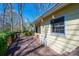 A cozy back deck perfect for relaxing with views of the surrounding trees and greenery at 5451 Gunpowder Dr, Hickory, NC 28601