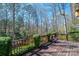 A well-maintained back deck providing a serene view of the lush, surrounding trees at 5451 Gunpowder Dr, Hickory, NC 28601
