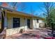 This yellow home features a back deck overlooking a picturesque backyard at 5451 Gunpowder Dr, Hickory, NC 28601