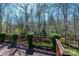This back deck provides views of surrounding trees and greenery at 5451 Gunpowder Dr, Hickory, NC 28601