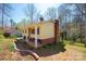 A view of the rear exterior, highlighting its architectural details and expansive yard at 5451 Gunpowder Dr, Hickory, NC 28601