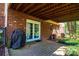 An open back patio with brick siding and a full view of the backyard area at 5451 Gunpowder Dr, Hickory, NC 28601