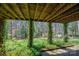 A view from the back porch showing the backyard and the vine-covered porch support posts at 5451 Gunpowder Dr, Hickory, NC 28601