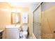 Bathroom featuring white vanity, toilet, shower with glass doors, and neutral walls at 5451 Gunpowder Dr, Hickory, NC 28601