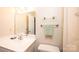 Bathroom featuring vanity with sink, toilet, towel rack, and neutral walls at 5451 Gunpowder Dr, Hickory, NC 28601