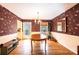 Cozy dining room featuring wallpaper, a chandelier, and hardwood floors at 5451 Gunpowder Dr, Hickory, NC 28601