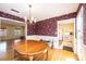 Bright dining room with vintage wallpaper, a chandelier, and hardwood floors at 5451 Gunpowder Dr, Hickory, NC 28601