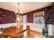 Inviting dining room featuring vintage wallpaper, a chandelier, and hardwood floors at 5451 Gunpowder Dr, Hickory, NC 28601