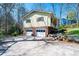 A bright home with a two-car garage and lush landscaping around the foundation at 5451 Gunpowder Dr, Hickory, NC 28601