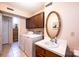 This laundry room features a washer and dryer, wooden cabinets, sink, and an ornate mirror at 5451 Gunpowder Dr, Hickory, NC 28601