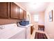 Convenient laundry room featuring washer, dryer, cabinets, and sink at 5451 Gunpowder Dr, Hickory, NC 28601