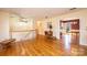 Bright living room with hardwood floors, open access to the dining room and staircase at 5451 Gunpowder Dr, Hickory, NC 28601