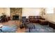 Spacious living room with a stone fireplace, hardwood floors, and comfortable leather sofa at 5451 Gunpowder Dr, Hickory, NC 28601