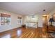 Open-plan room boasting hardwood floors, lots of natural light, and a staircase at 5451 Gunpowder Dr, Hickory, NC 28601