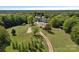 Expansive aerial view of estate property with home, outbuildings, and surrounding wooded acreage at 5546/5510 Hoodtown Rd, Sharon, SC 29742