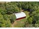 Aerial view of the spacious barn, perfect for storage or hobbies amidst the trees at 5546/5510 Hoodtown Rd, Sharon, SC 29742