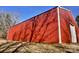 A large, well-maintained barn with a long exterior and side door access at 5546/5510 Hoodtown Rd, Sharon, SC 29742