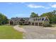 Charming home featuring three-car garage, mature landscaping, and inviting entrance at 5546/5510 Hoodtown Rd, Sharon, SC 29742
