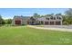 Charming exterior of the home with a well-manicured lawn and three-car garage at 5546/5510 Hoodtown Rd, Sharon, SC 29742