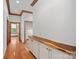 Hallway with hardwood floors and white cabinets with wood countertop at 5546/5510 Hoodtown Rd, Sharon, SC 29742