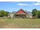 Charming home with a cozy front porch, lush landscaping, and a vibrant green lawn at 5546/5510 Hoodtown Rd, Sharon, SC 29742