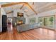 Inviting living room with a stone fireplace, hardwood floors and vaulted ceilings at 5546/5510 Hoodtown Rd, Sharon, SC 29742