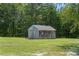 Charming outbuilding featuring wooden construction and a quaint design in a grassy surrounding at 5546/5510 Hoodtown Rd, Sharon, SC 29742