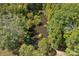 Scenic pond view surrounded by mature trees; an outdoor oasis on the property at 5546/5510 Hoodtown Rd, Sharon, SC 29742